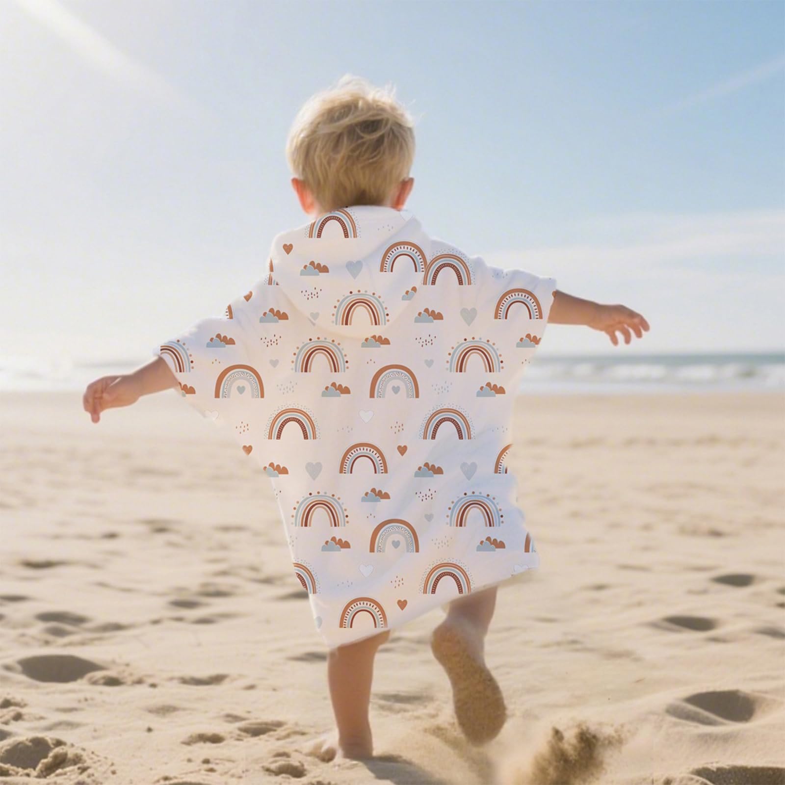CoolaPeach toddler hooded towel drying in sunlight after swimming.