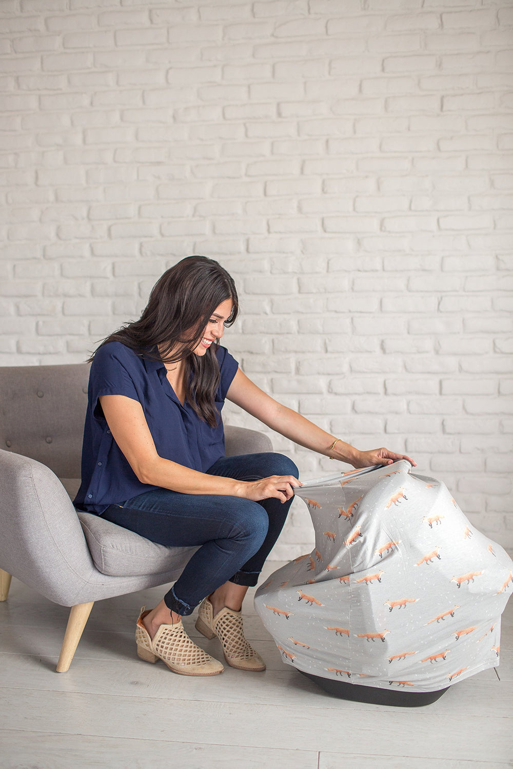 Copper Pearl 5-in-1 stretchy cover on a seat shows multi-use compatibility for car seats
