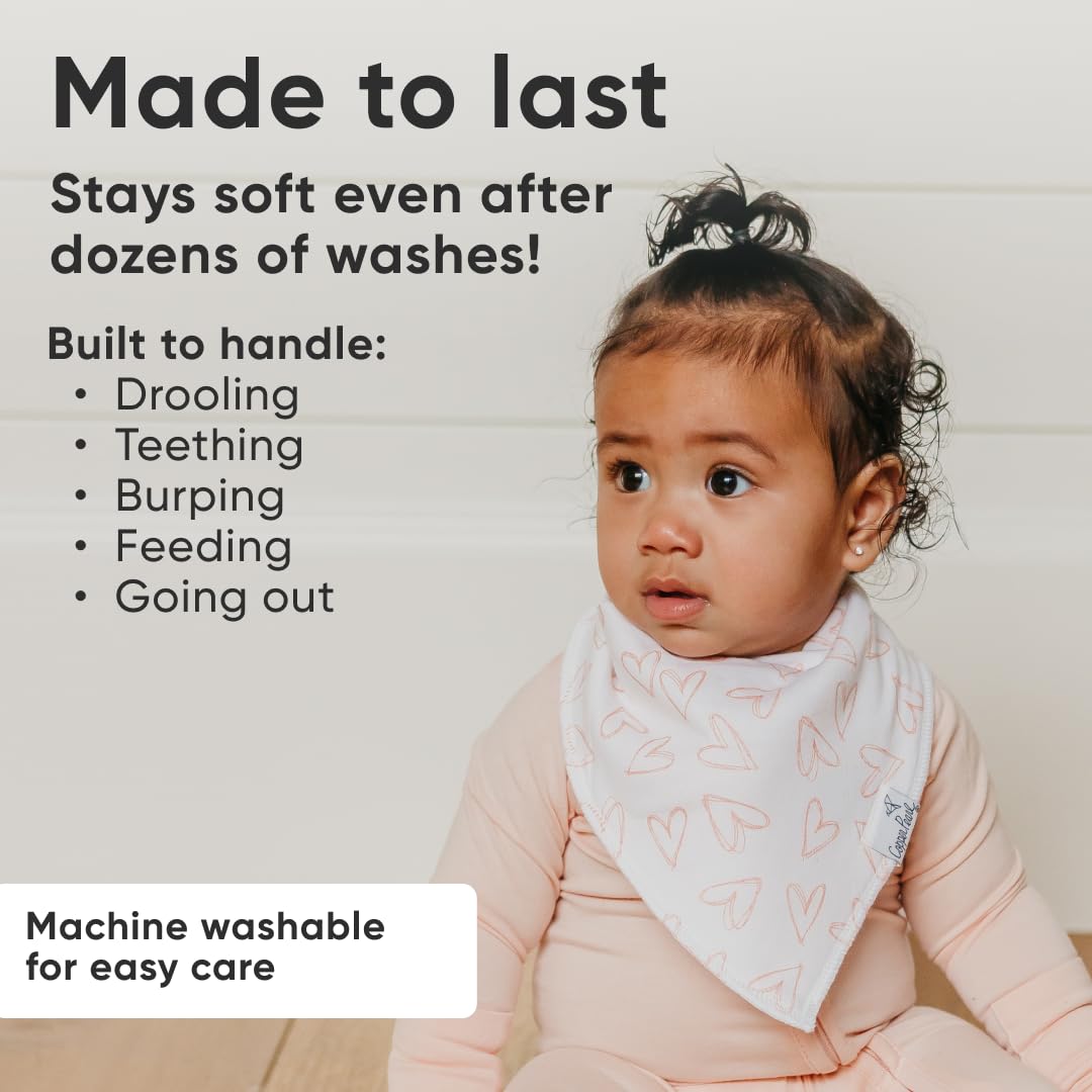 Copper Pearl baby bibs with adjustable snaps demonstrating newborn-to-toddler fit.