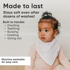 Copper Pearl baby bibs with adjustable snaps demonstrating newborn-to-toddler fit.