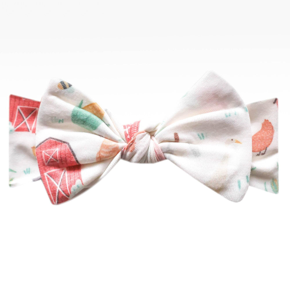 Copper Pearl baby bows closeup, showcasing soft fabric for gentle newborn comfort.