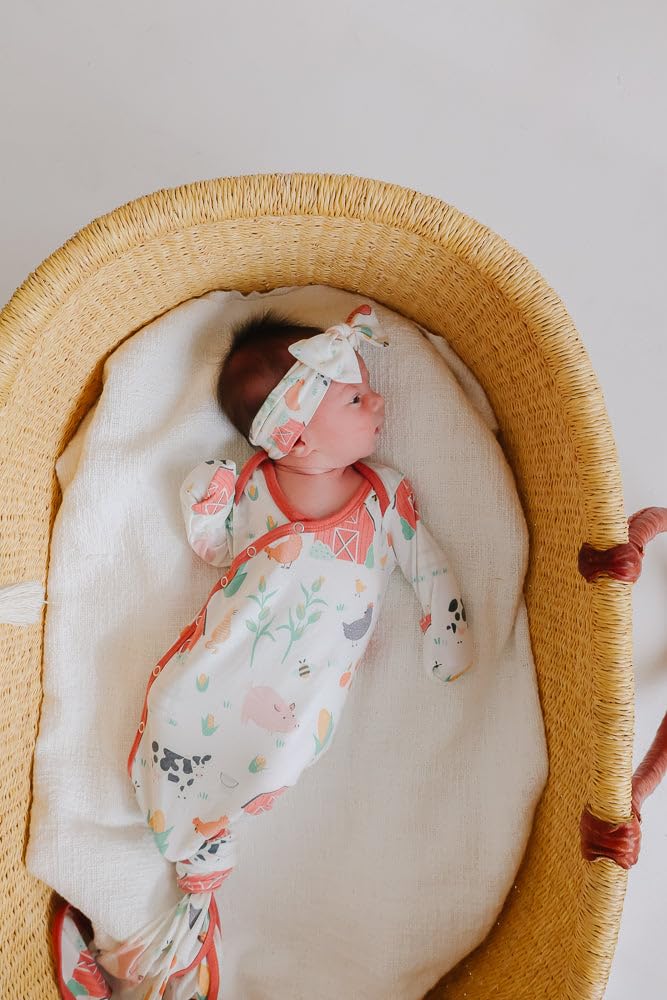 Copper Pearl baby bows coordinated with swaddles for cohesive newborn outfits.