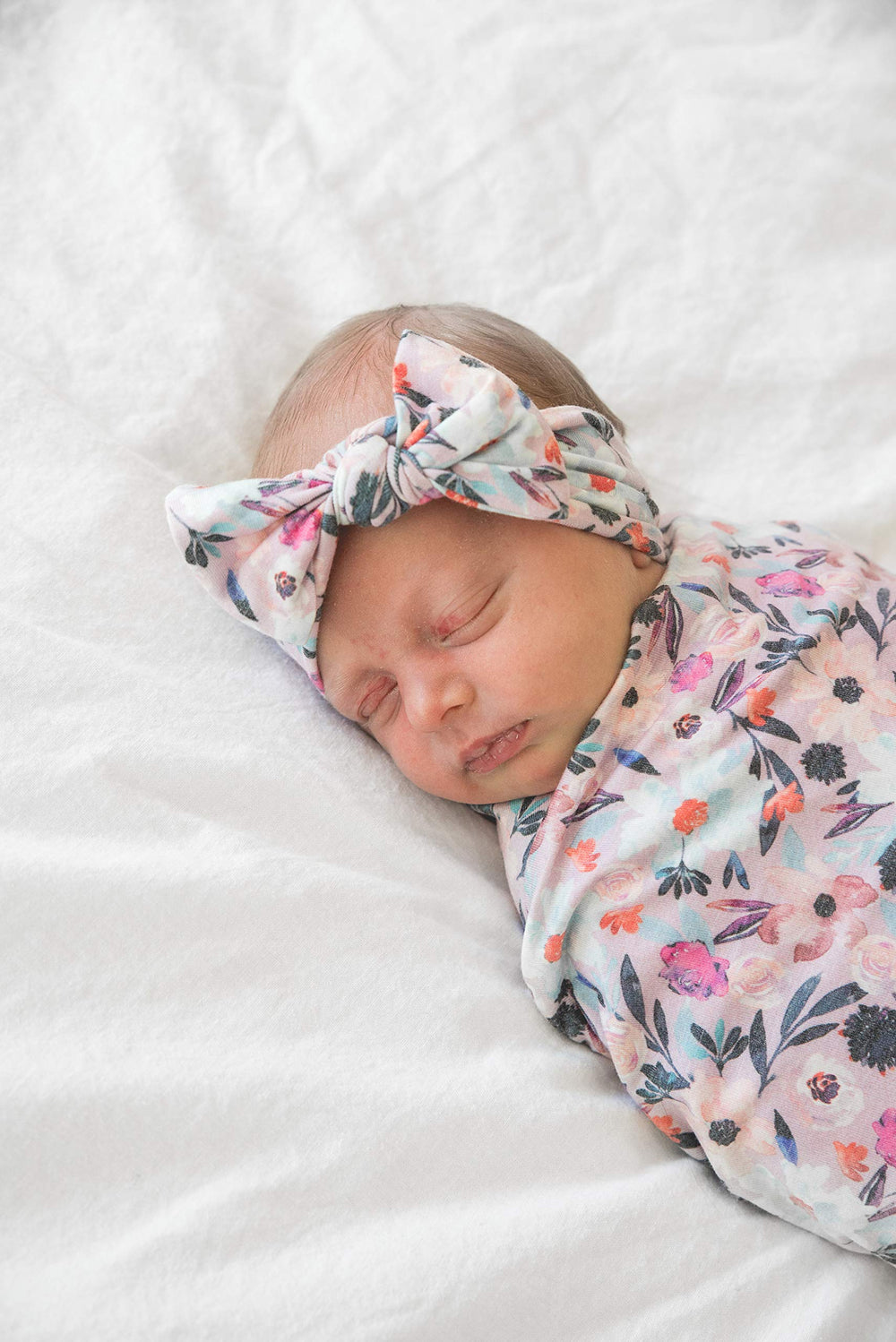 Copper Pearl bows coordinate with swaddles for a cohesive look.