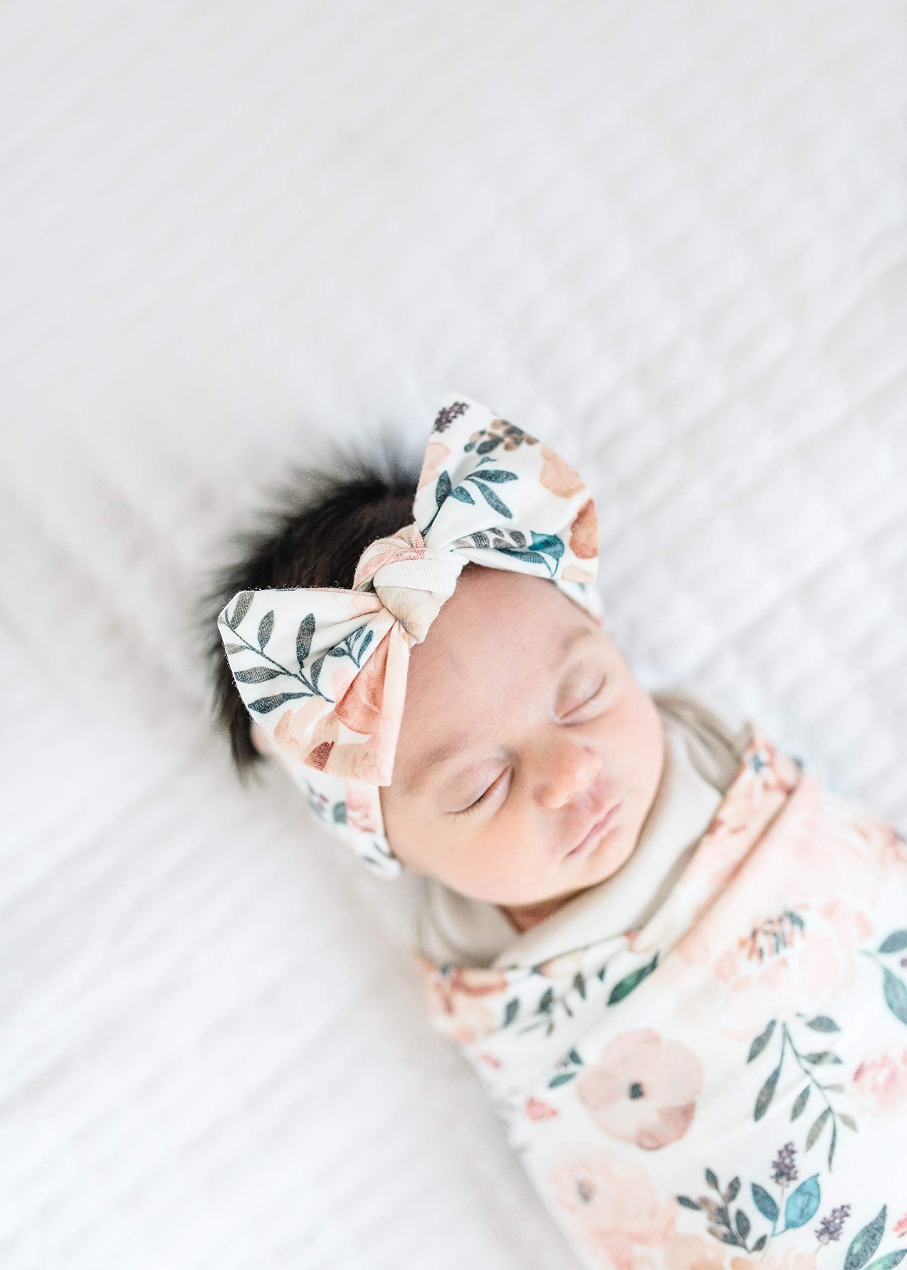 Copper Pearl gift packaging ready for shower gifting with stylish baby bows.