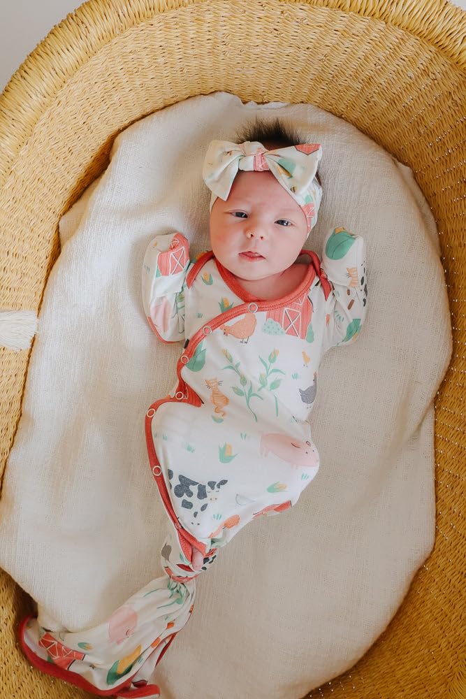 Copper Pearl baby bows stretchy band demo shows flexible fit through months.