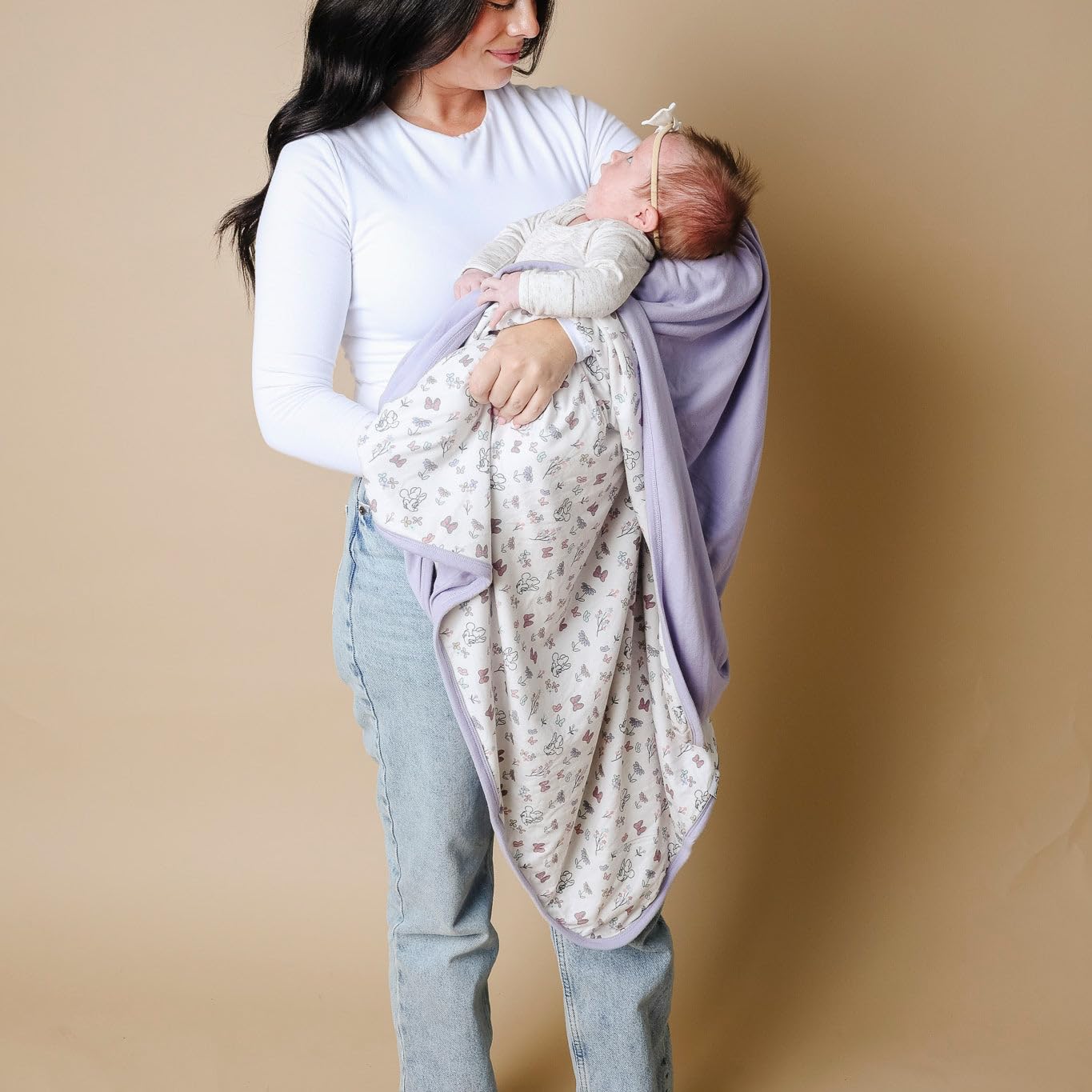 Copper Pearl baby snuggle with quilt shows secure comfort for swaddles and story time.