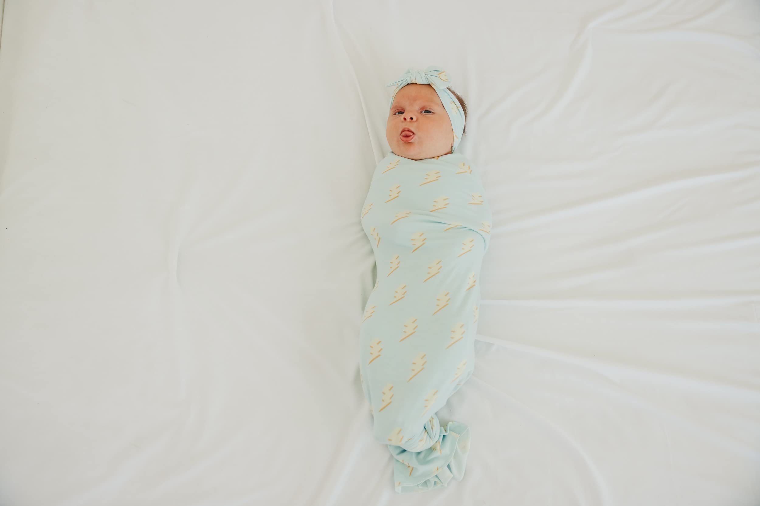 Copper Pearl baby swaddle blanket unisex print communicates modern baby style.