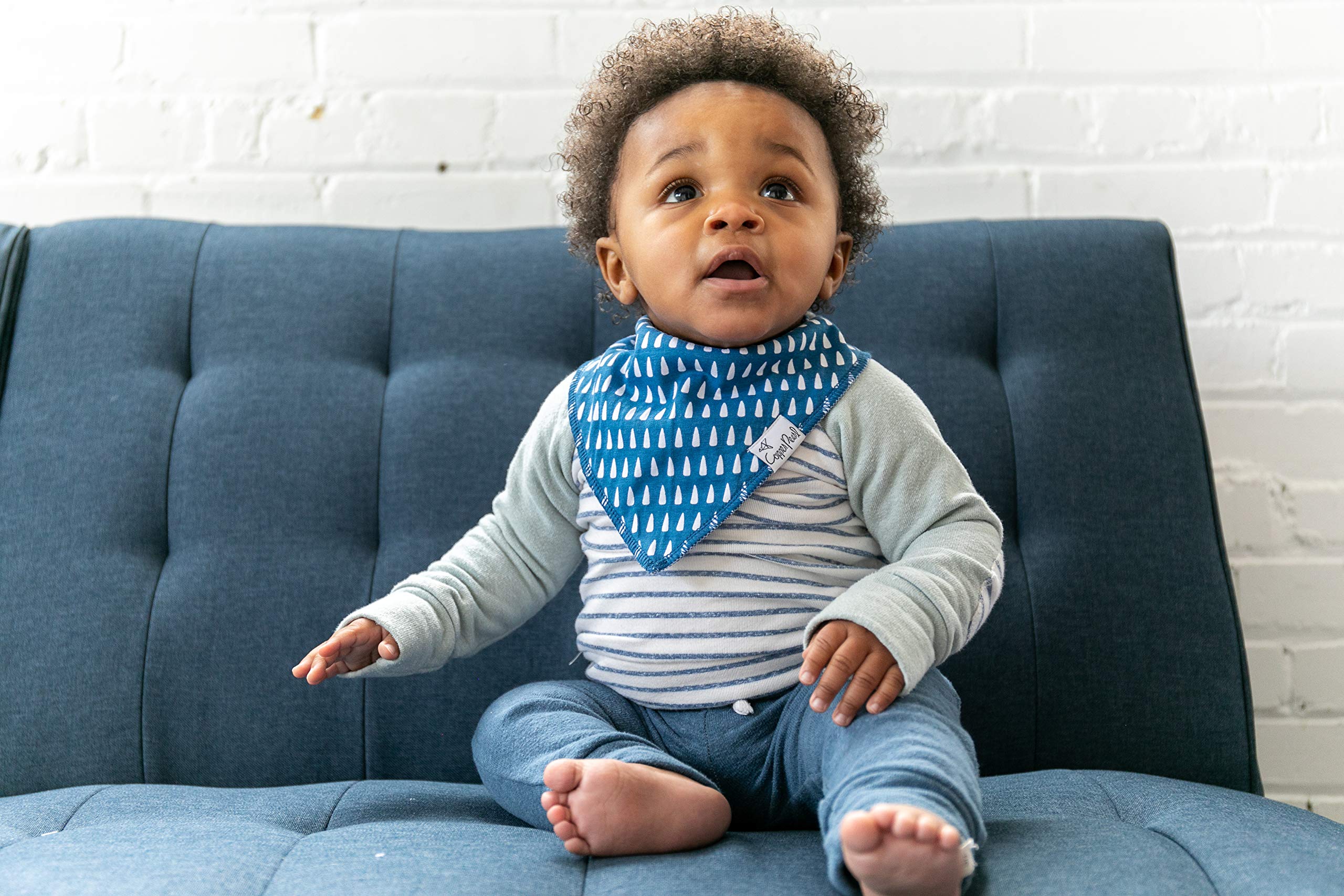 Copper Pearl bandana bib adjustable snaps demonstrate grow-with-baby functionality.