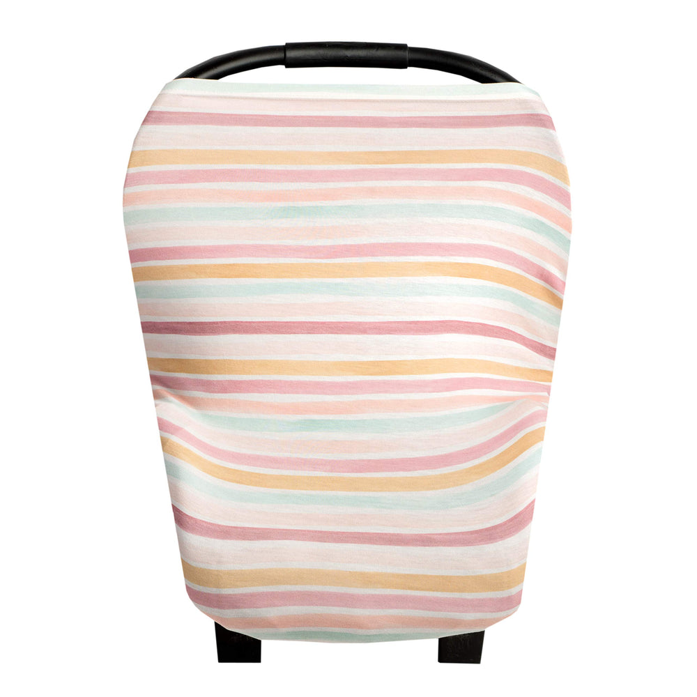 Copper Pearl Belle multi-use cover on a car seat shields sun with breathable fabric.