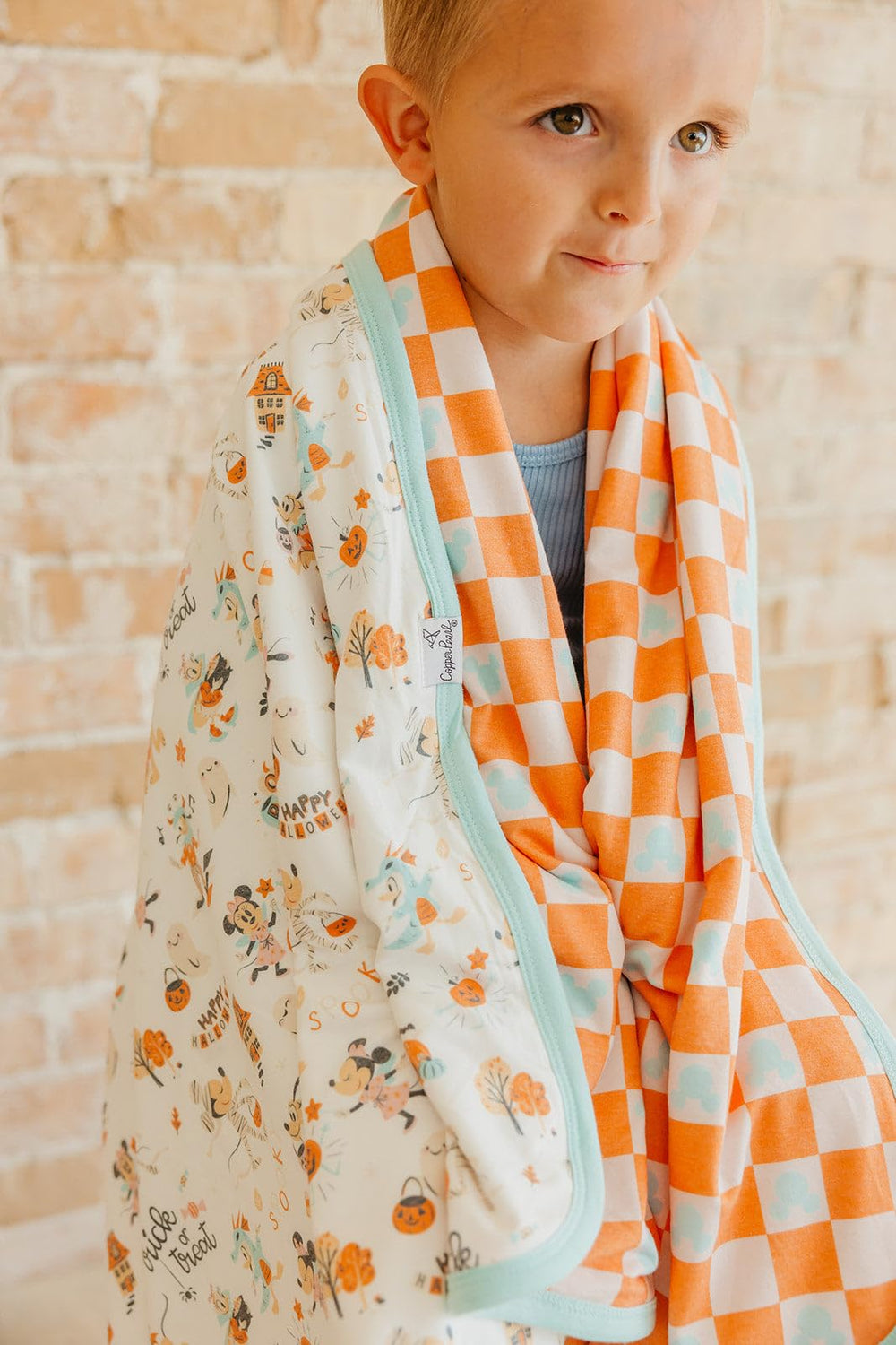 Copper Pearl blanket edges serged for longevity, keeping baby cozy during naps
