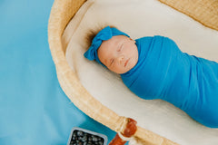 Copper Pearl Blueberry swaddle doubles as nursing cover for discreet feeds.