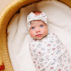 Copper Pearl bow headband Minnie print on newborn-ready fabric boosts everyday baby style.