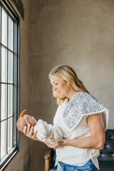 Copper Pearl burp cloth large Bones pattern paired with cozy practicality.