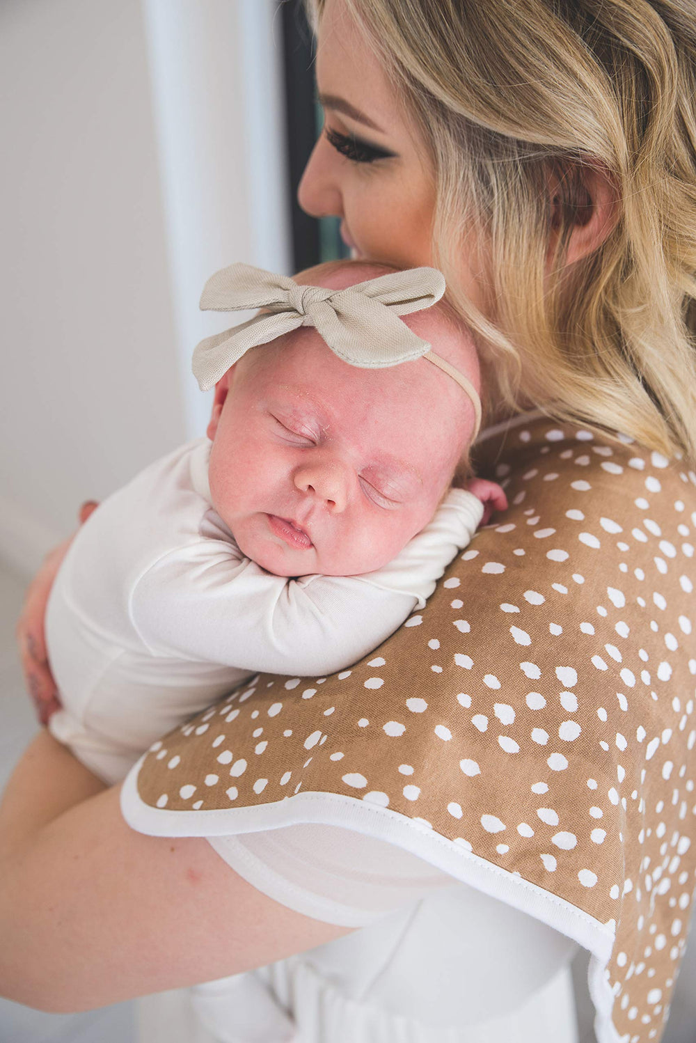 Copper Pearl burp cloth size 21x10 demonstrates generous shoulder coverage for parents