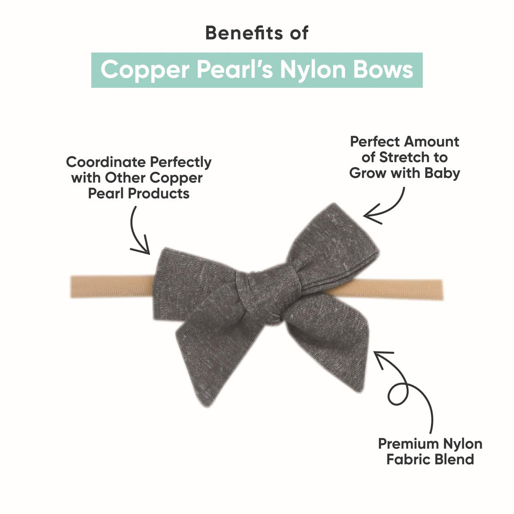 Copper Pearl Classic Baby Bow Berry on baby headband demonstrates gentle stretch for growing infants.