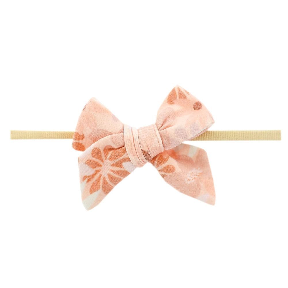 Copper Pearl Classic Baby Bow Penny—front view shows soft stretch for newborn comfort.