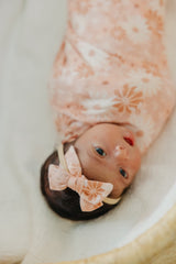 Copper Pearl Classic Baby Bow Penny—wearable on baby with flexible fit for growing infants.