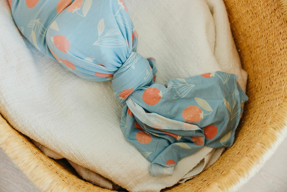 Copper Pearl Clementine swaddle nursing cover view highlights discreet feeding support.