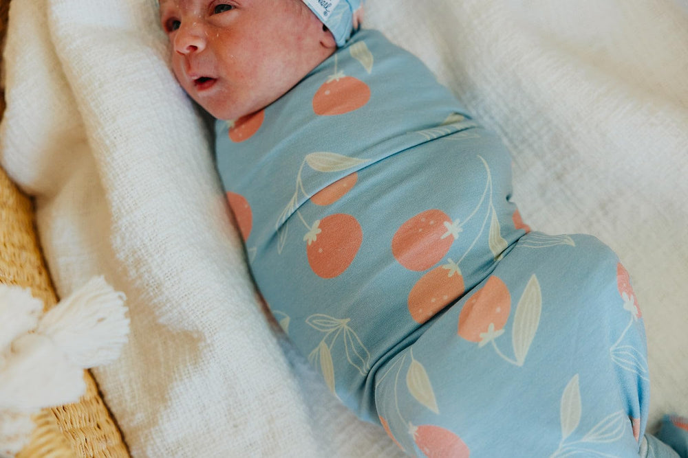 Copper Pearl Clementine swaddle receiving blanket shows versatile wrap option for cozy moments.