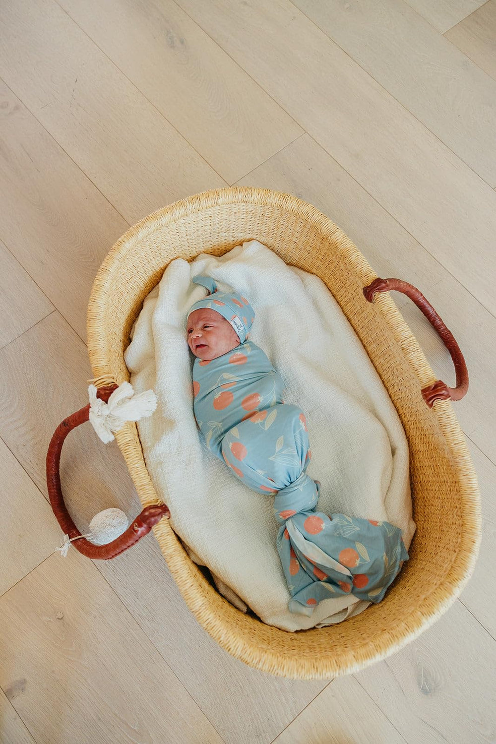 Copper Pearl Clementine swaddle stroller shield in use on a stroller for on-the-go shade.