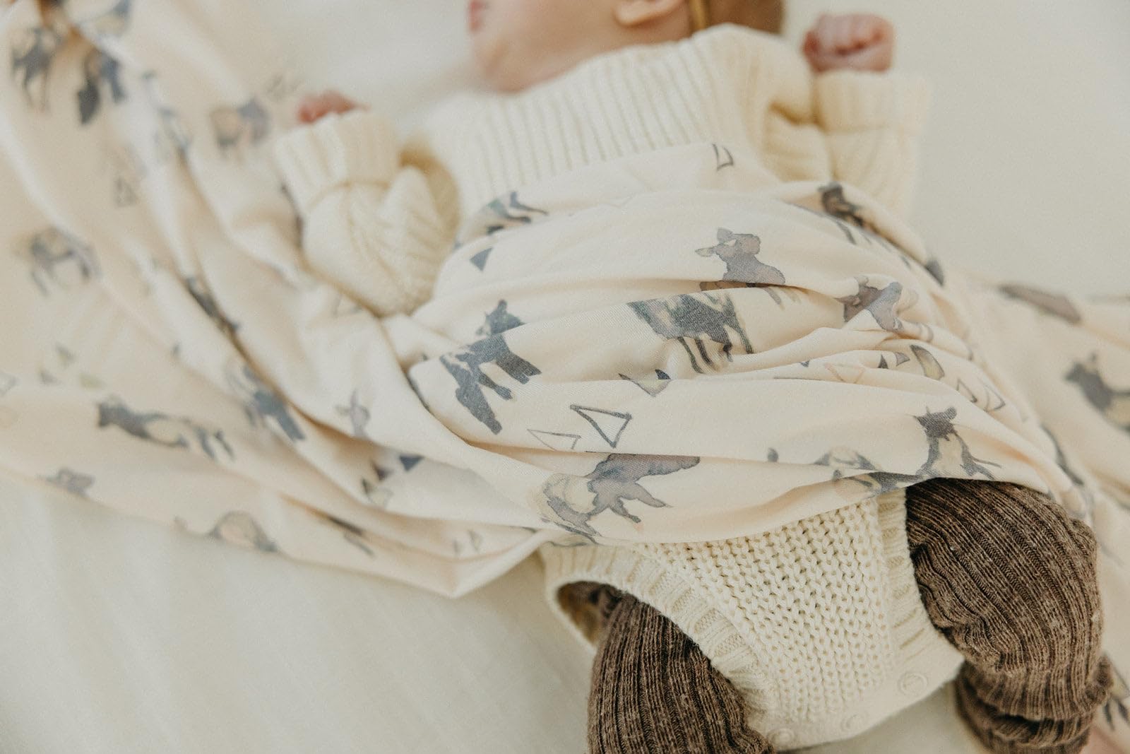 Copper Pearl Cody swaddle doubles as stroller shield on outings.