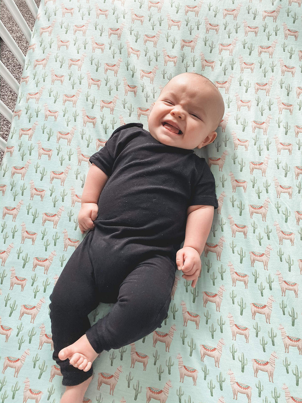 Copper Pearl Cusco knit crib sheet in a cozy nursery sleep scene