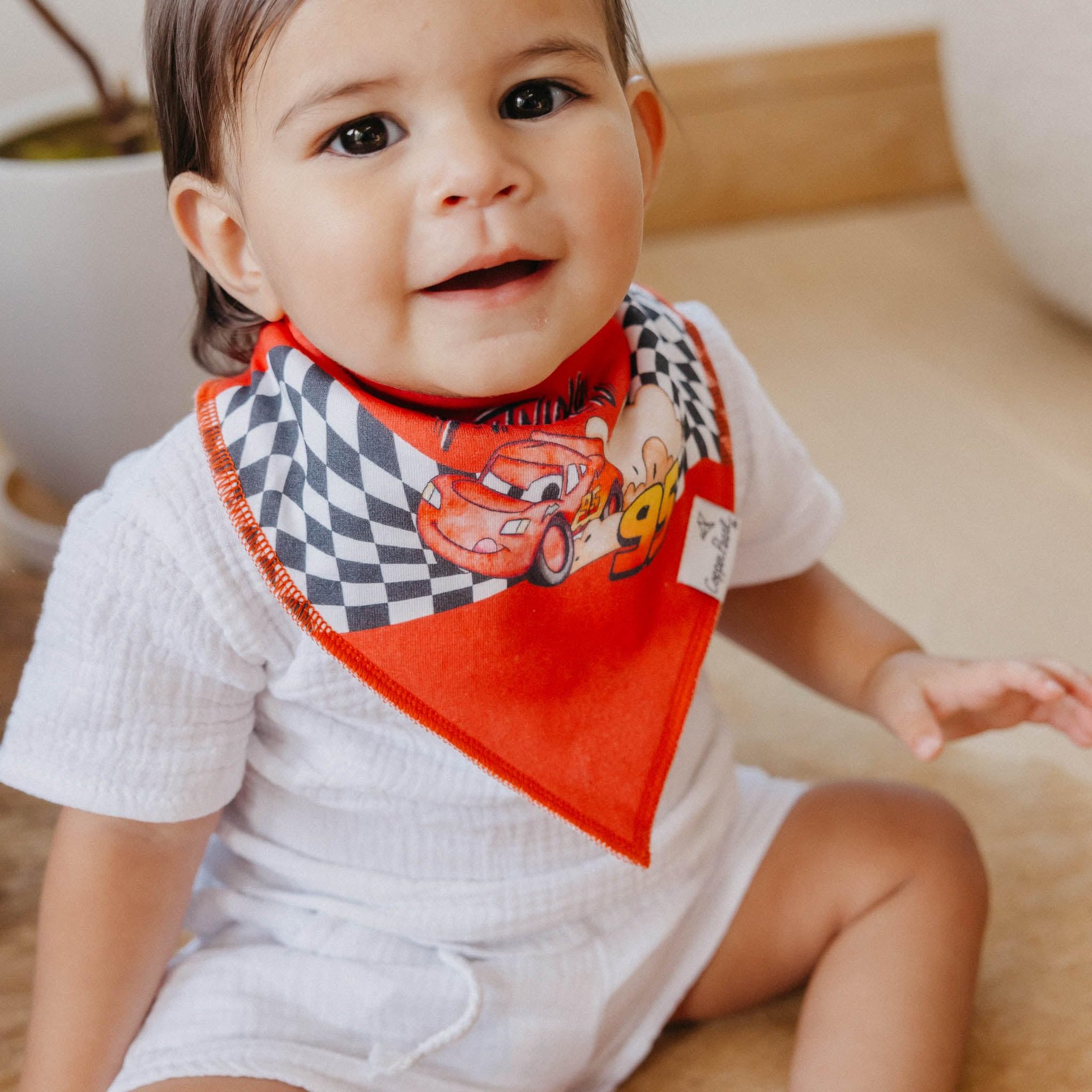 Copper Pearl Disney Pixar Cars bib with adjustable nickel-free snaps for 3-24 months