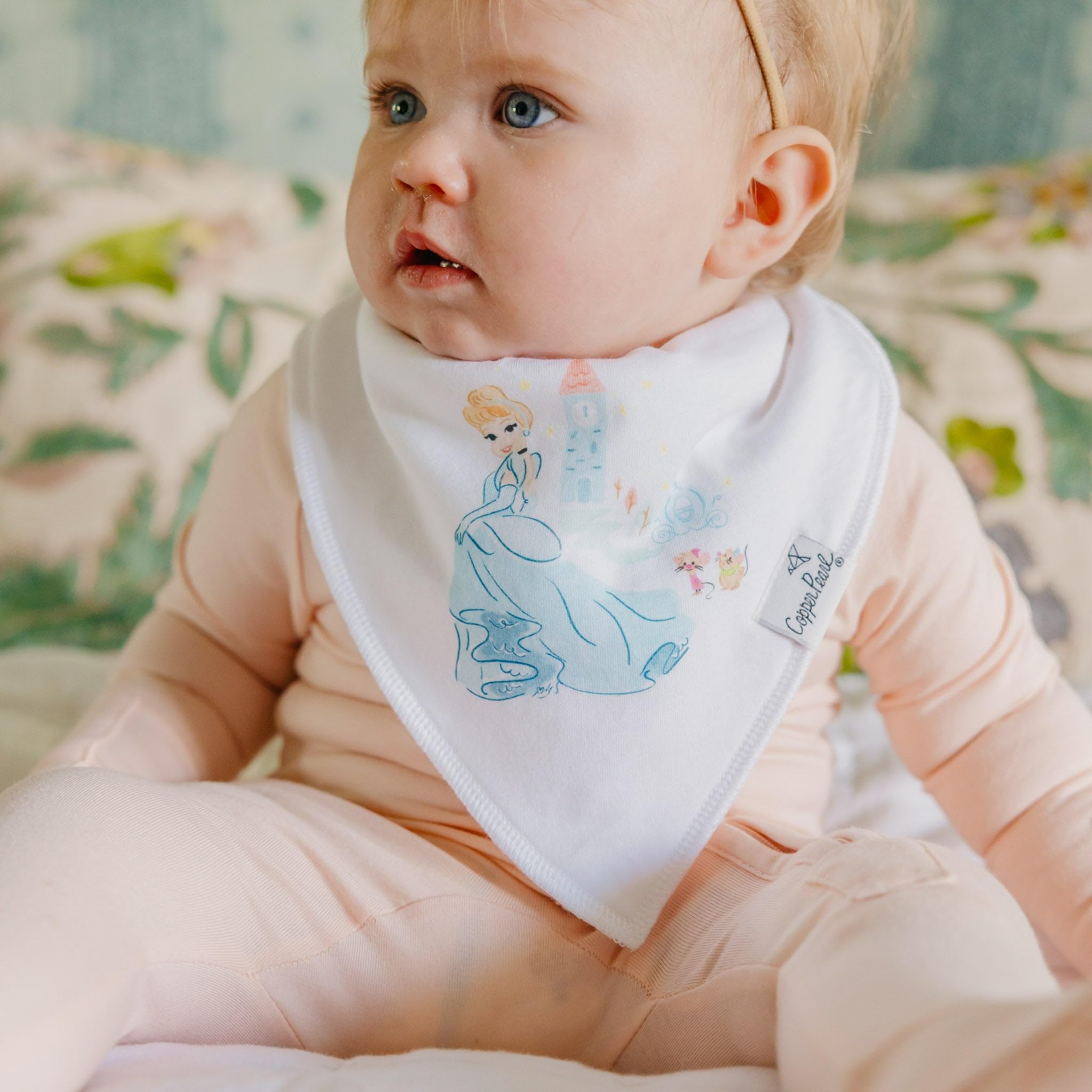 Copper Pearl Disney Princess bib in action with toddler
