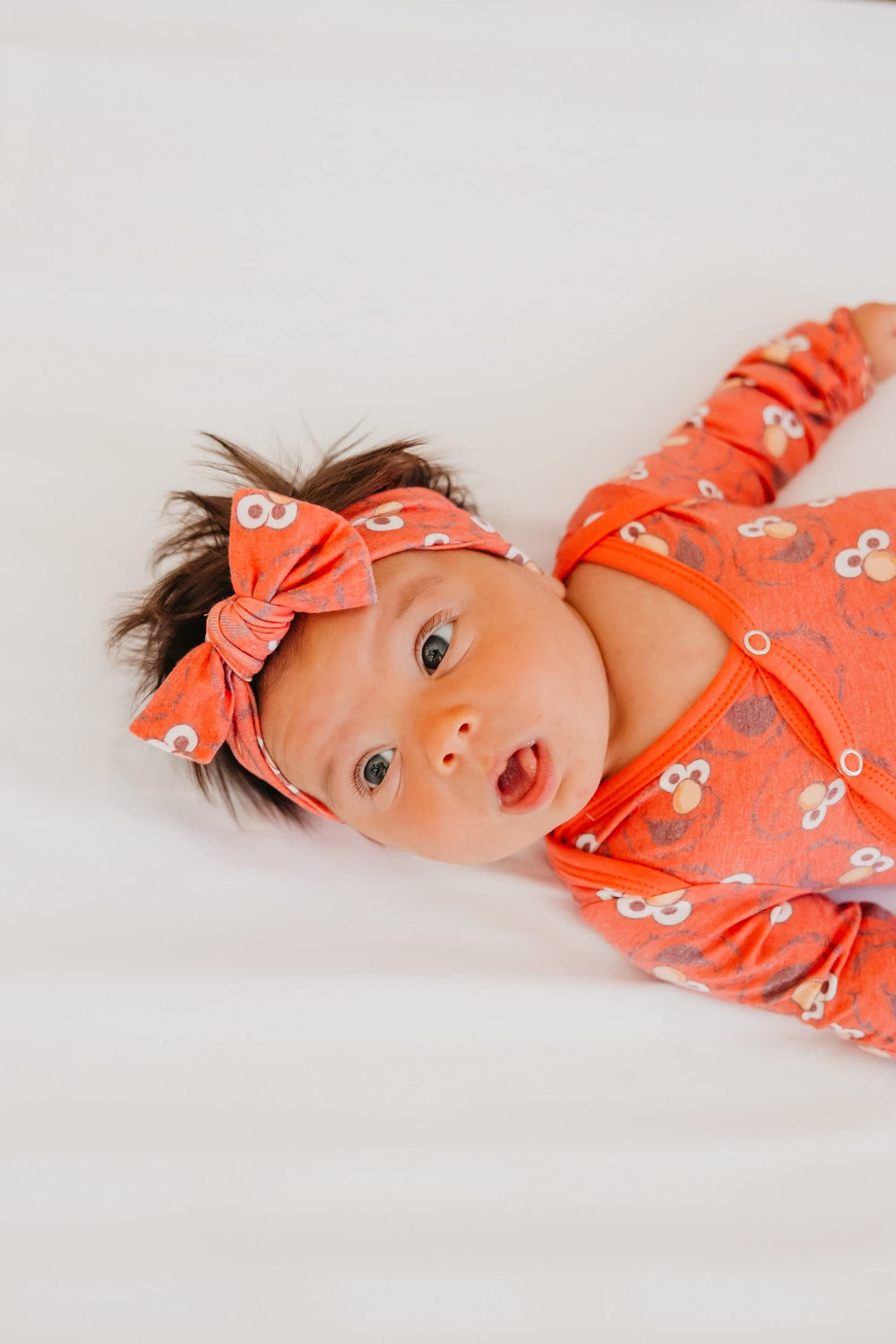 Copper Pearl Elmo Bow coordinating swaddle pairing creates a cohesive look