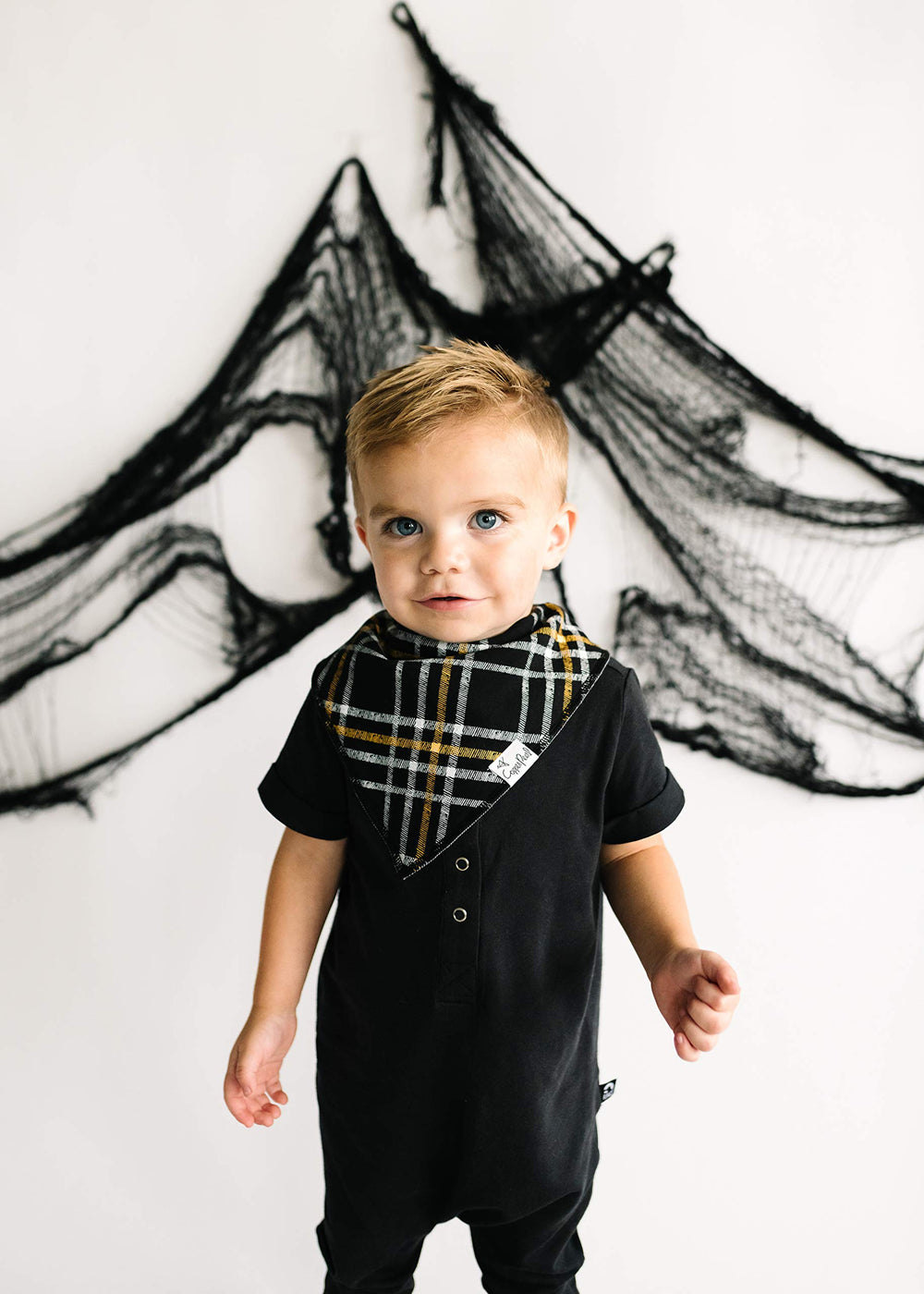 Copper Pearl Patch print on bib adds fashion-forward flair to outfits.