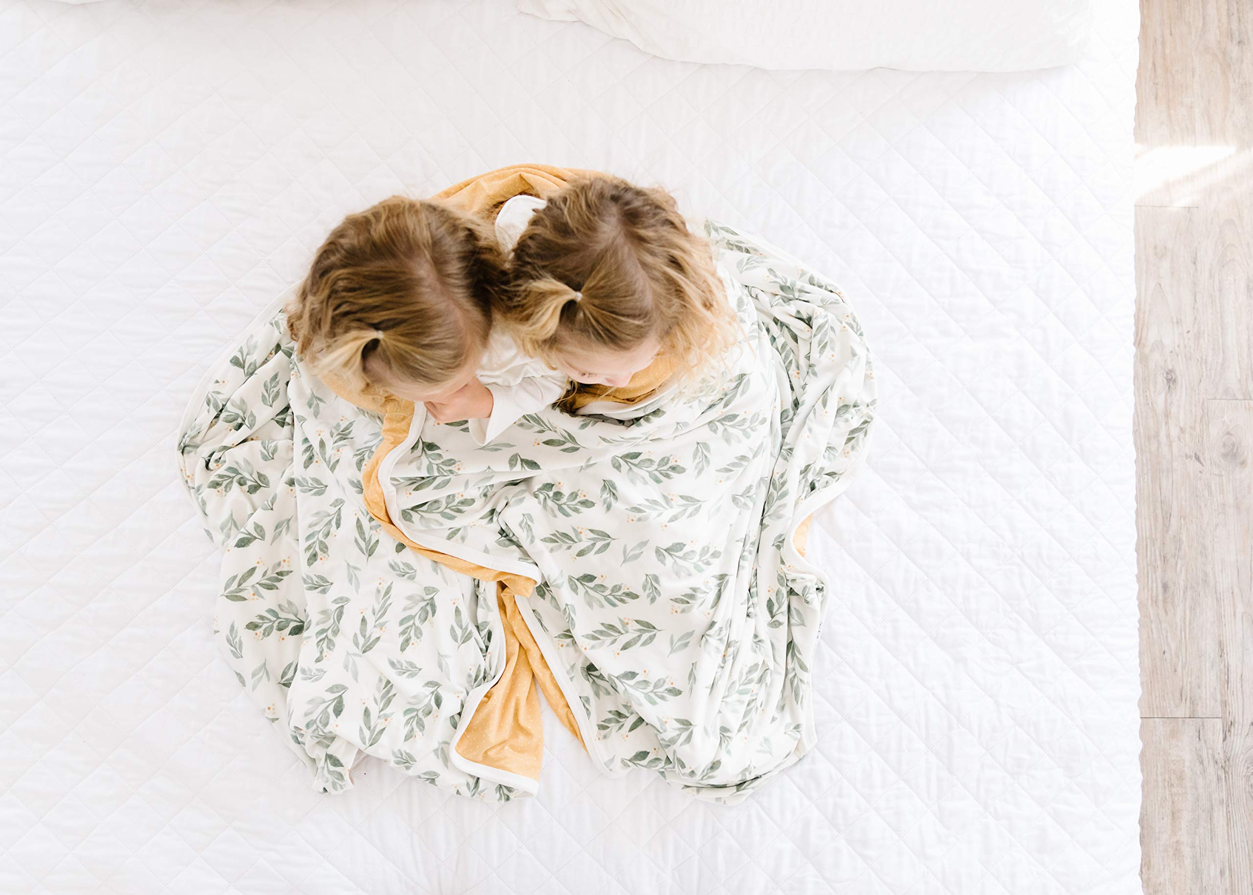 Copper Pearl jumbo 3-layer blanket fern in a cozy crib-room setup.