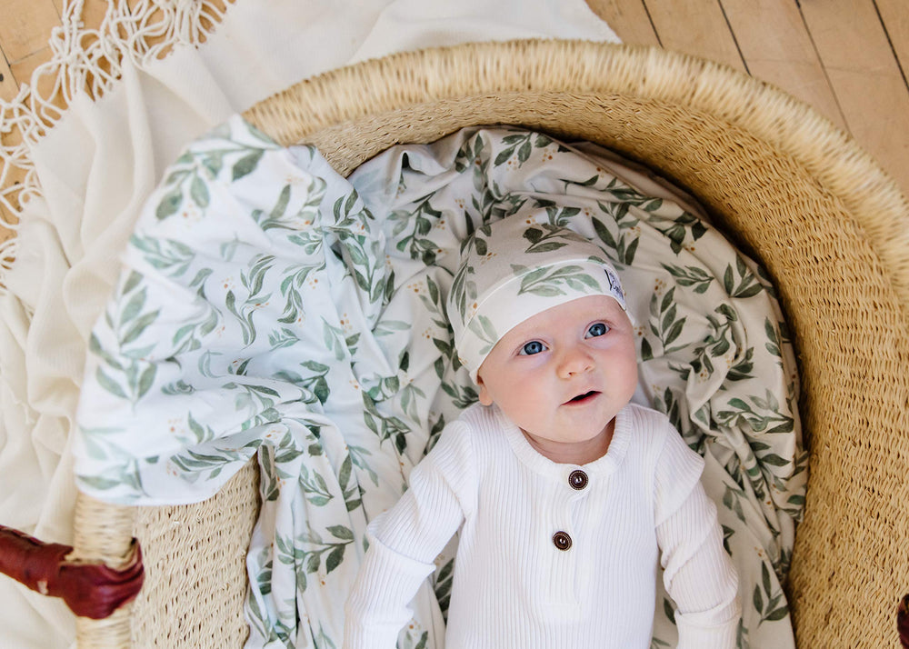 Copper Pearl Fern swaddle blanket machine-washable care simplifies busy parent routines.