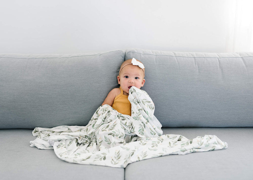 Copper Pearl Fern swaddle blanket toddler-use scene demonstrates growing comfort over time.