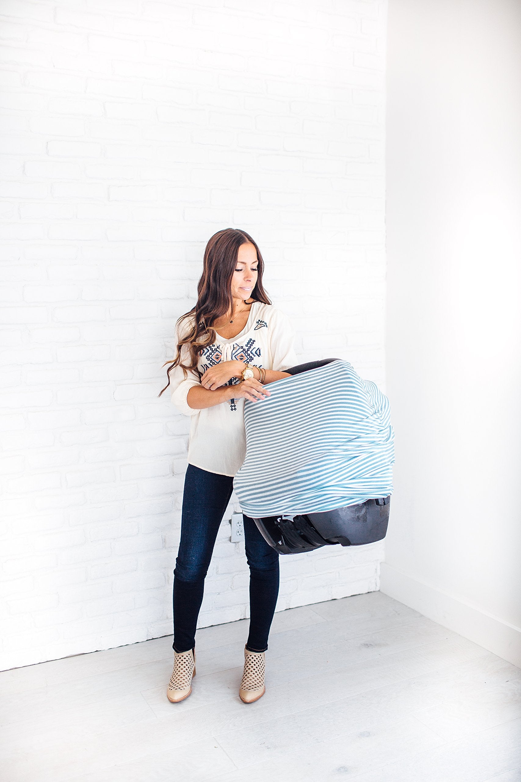 Copper Pearl Finn shopping-cart cover protects baby while shopping on the go.