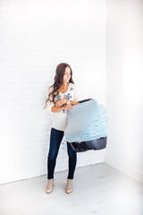 Copper Pearl Finn shopping-cart cover protects baby while shopping on the go.