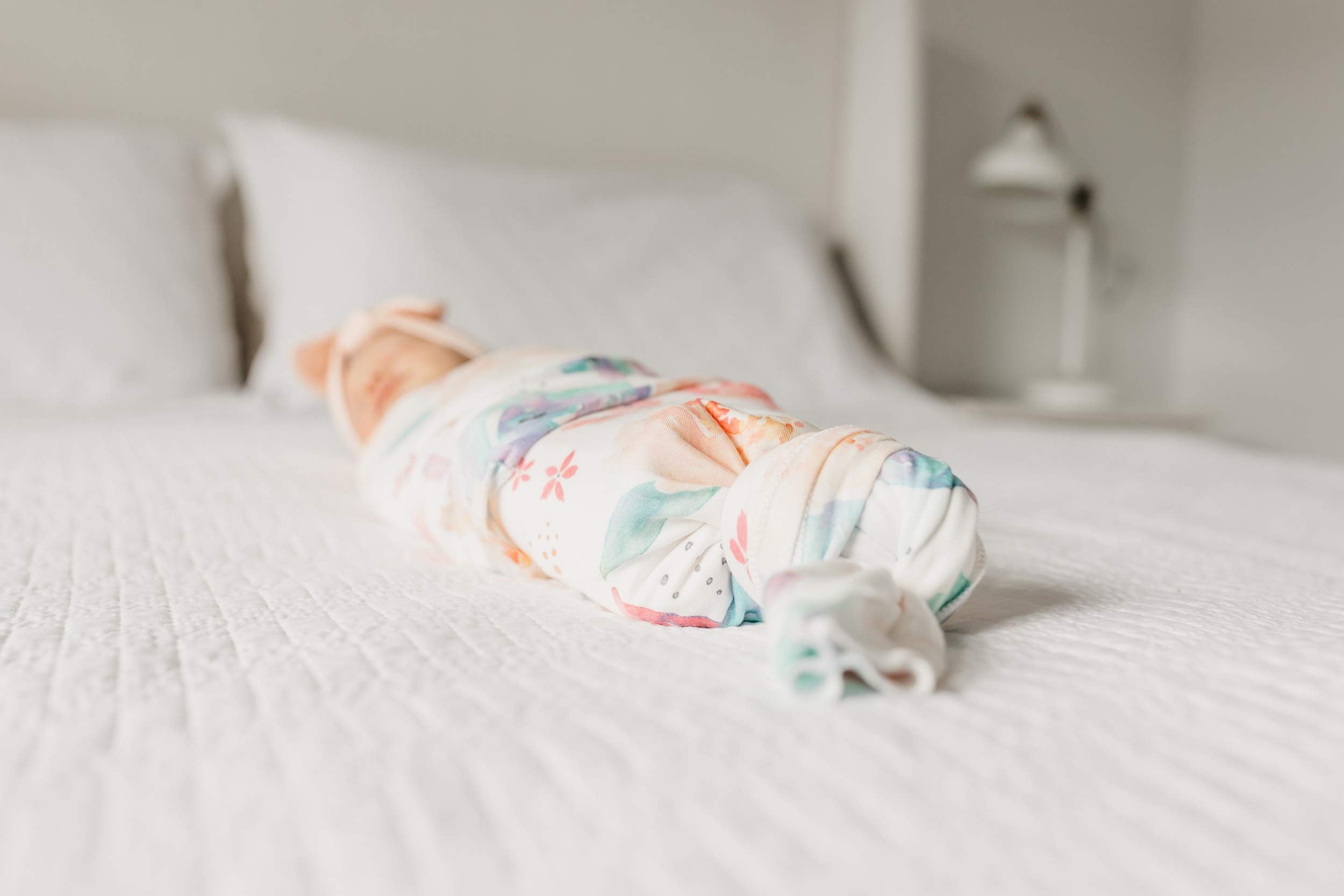 Copper Pearl Floral Bloom swaddle packaging highlights a stylish, practical gift.
