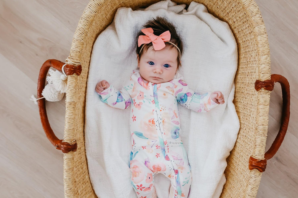 Copper Pearl footie pajamas in 3-6m close-up highlight flexible fit.