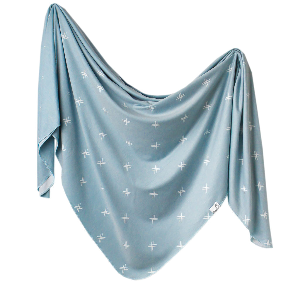 Copper Pearl Hayden swaddle blanket folded, showcasing premium knit softness for babies.