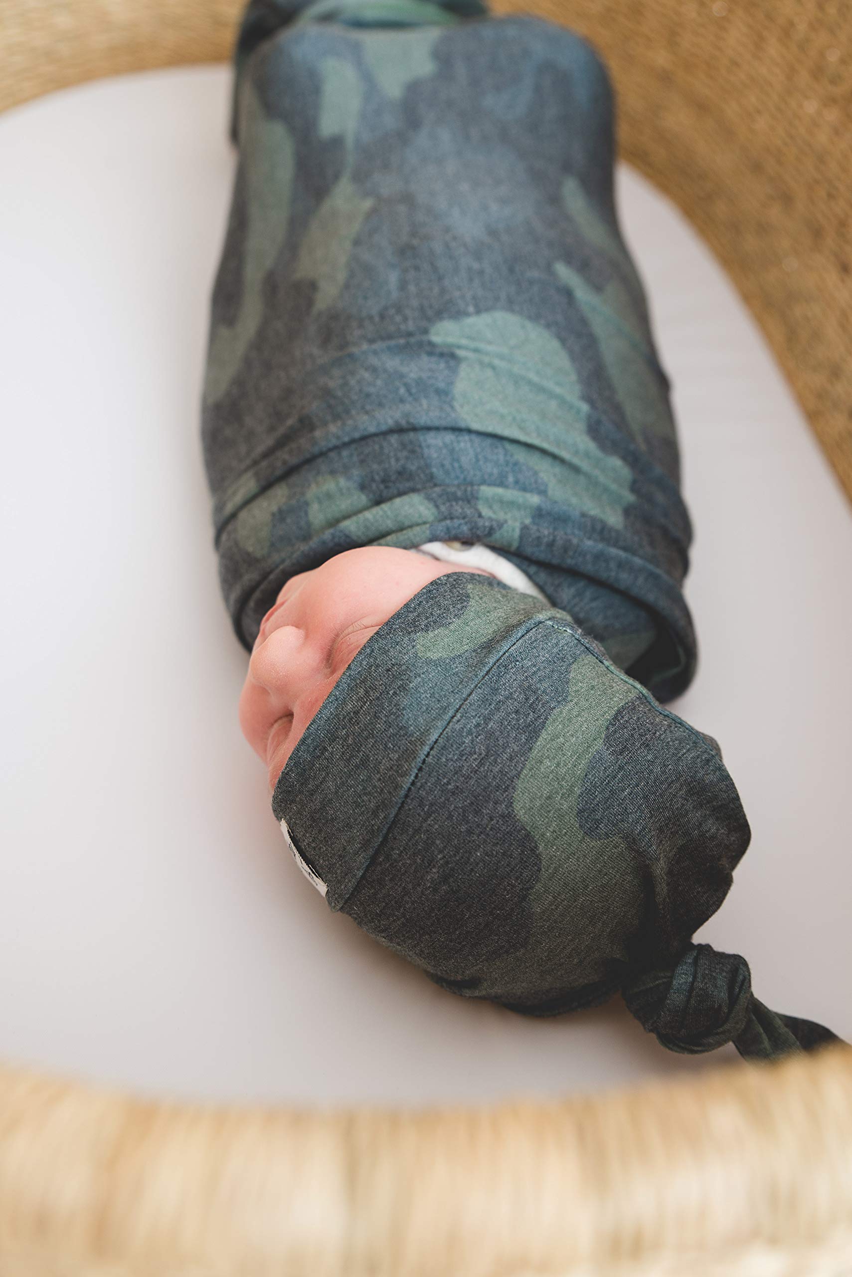 Copper Pearl Hunter swaddle blanket close-up edge stitching shows durable finishing.