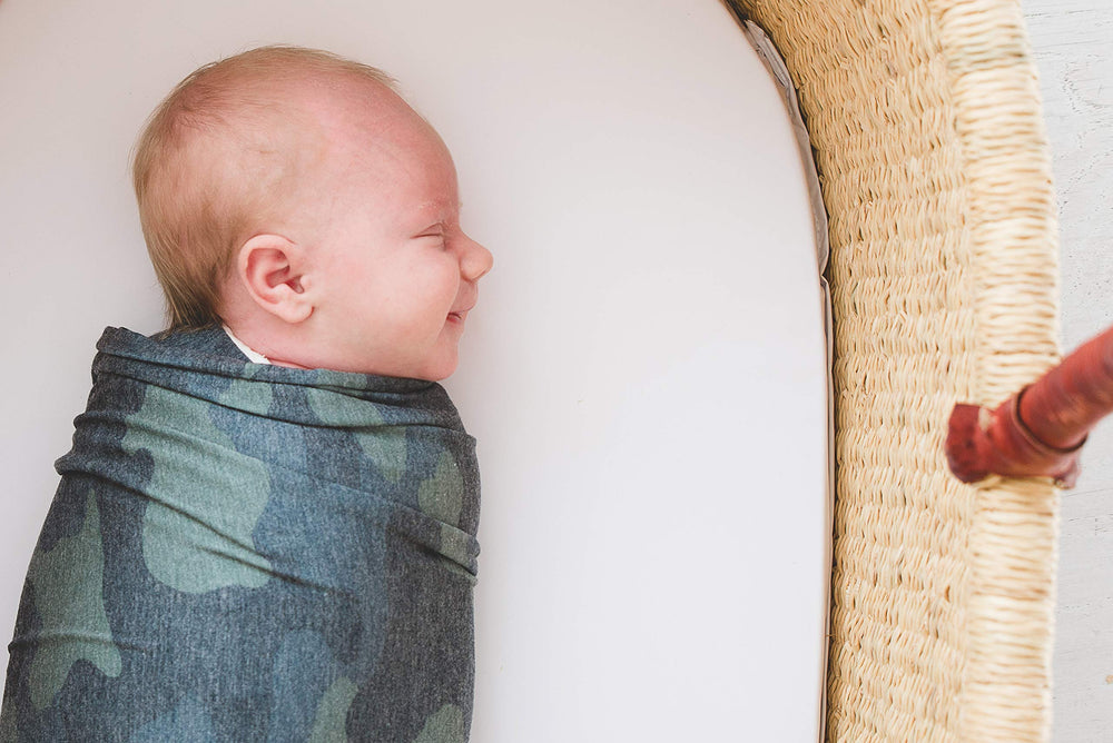 Copper Pearl Hunter swaddle blanket being gifted at baby shower.