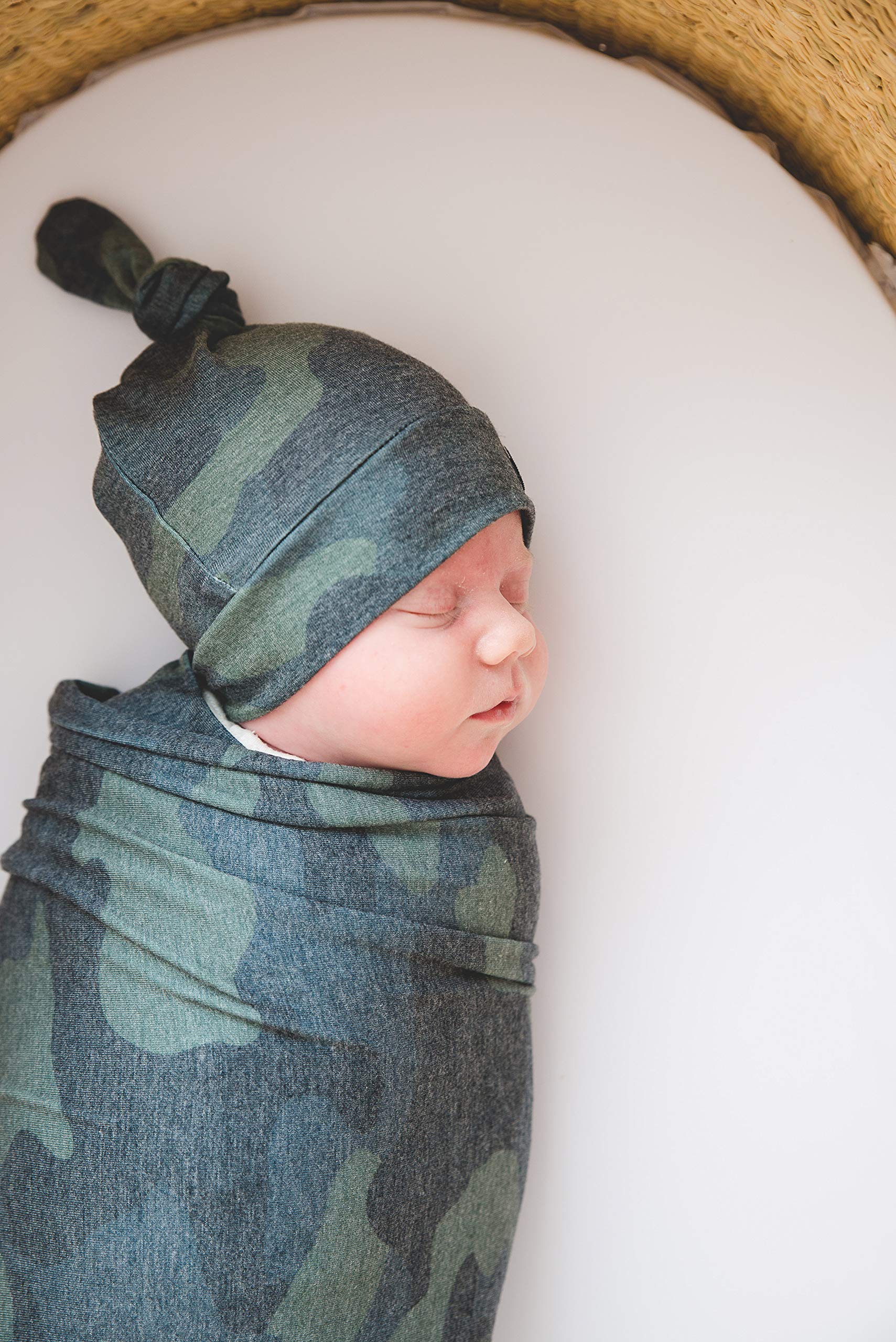 Copper Pearl Hunter swaddle blanket on nursery couch as cozy decorative layer.