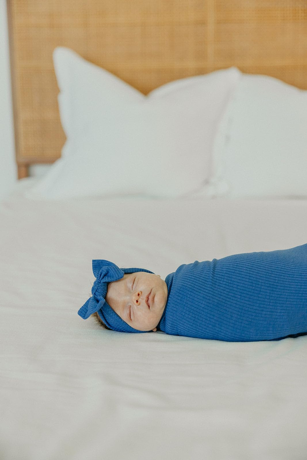 Copper Pearl Indigo swaddle pictured as stroller shield for on-the-go protection