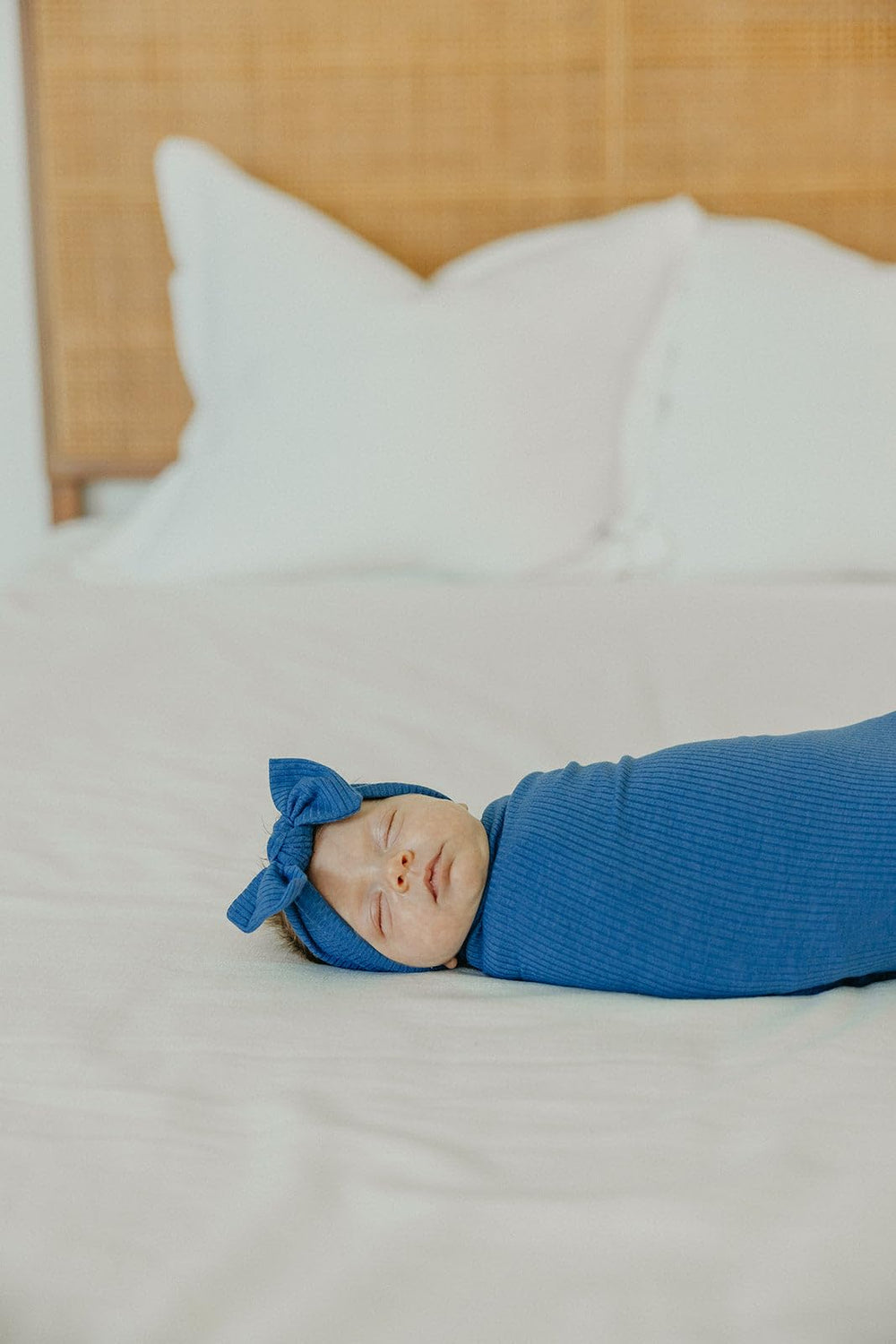 Copper Pearl Indigo swaddle pictured as stroller shield for on-the-go protection