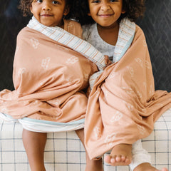 Copper Pearl Jumbo Knit Throw on couch adds family-friendly warmth