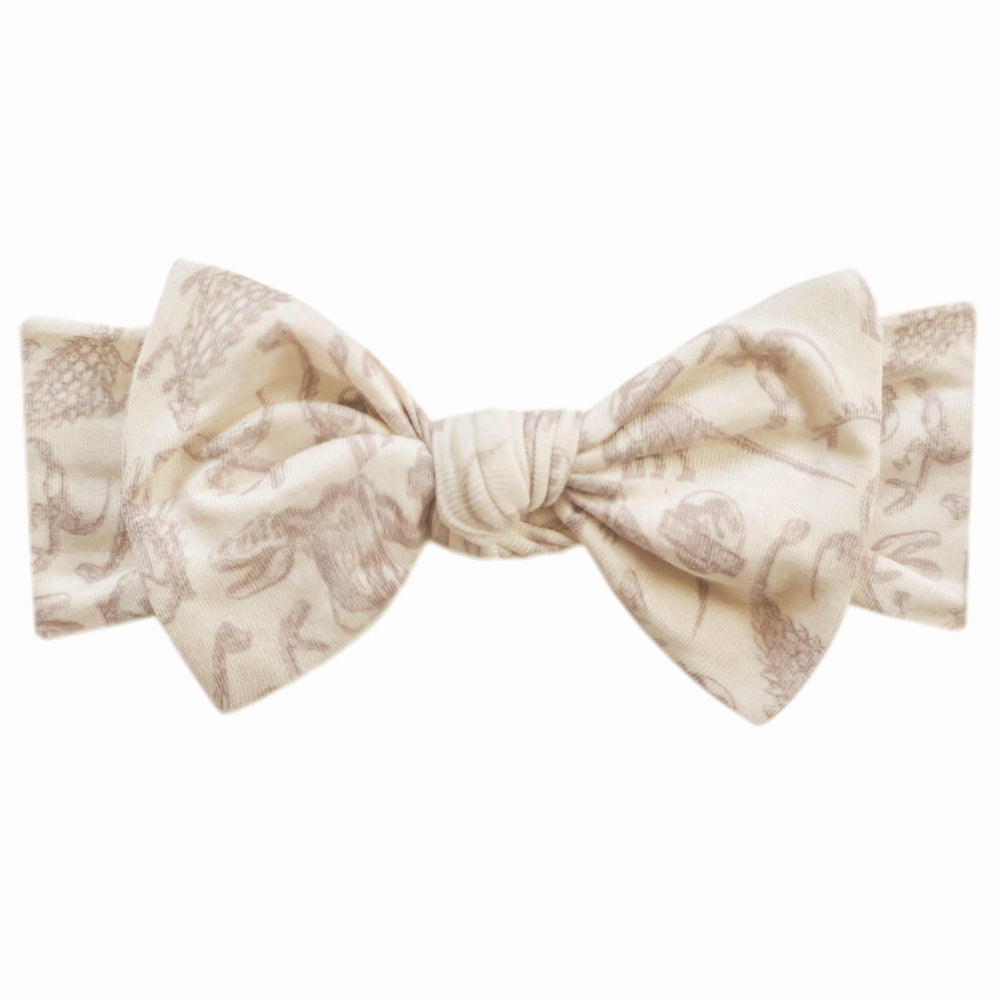 Copper Pearl Jurassic Park Fossils headband shown on a newborn for everyday wear