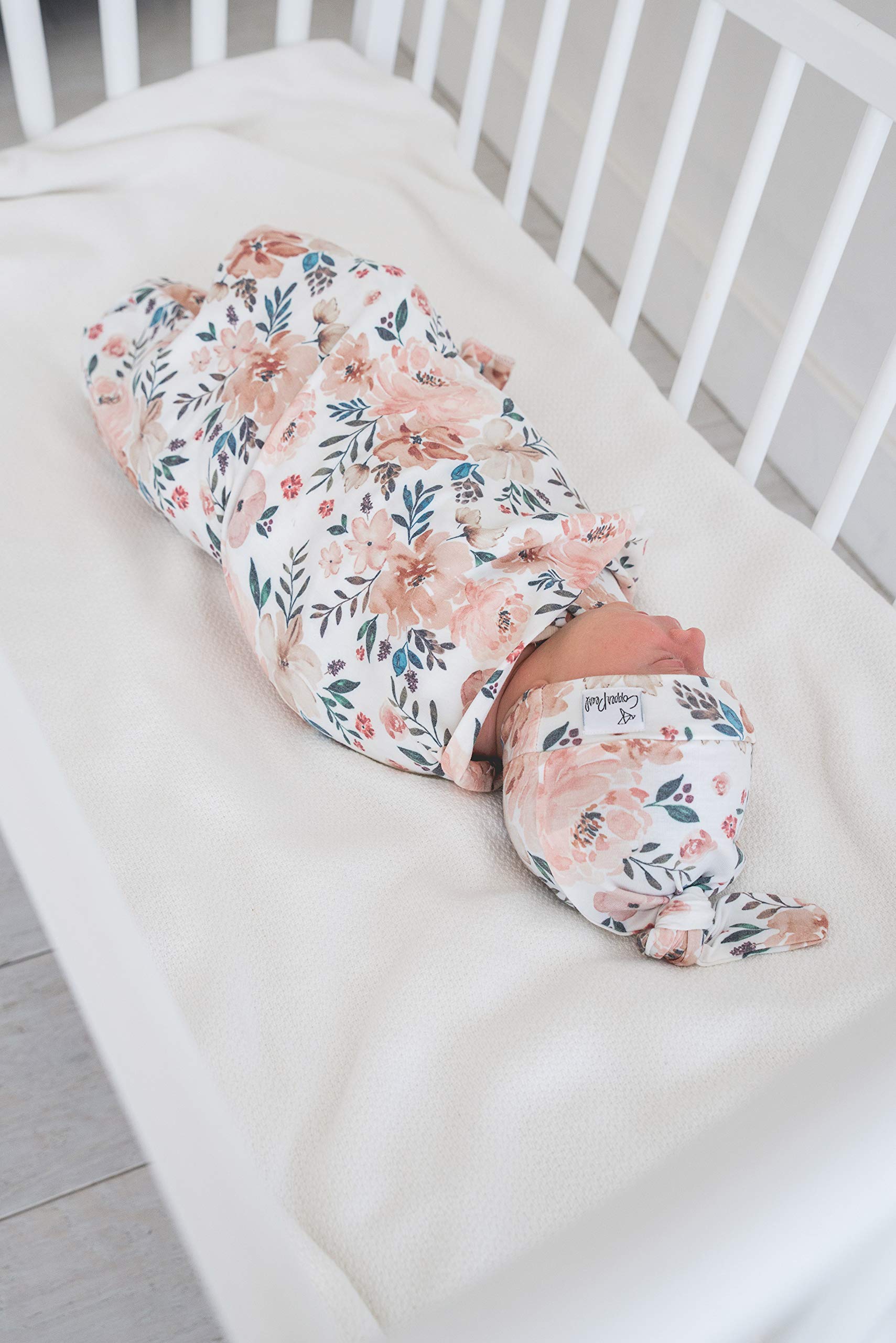 Copper Pearl Large Knit Swaddle Autumn baby blanket used as a comfortable stroller cover.