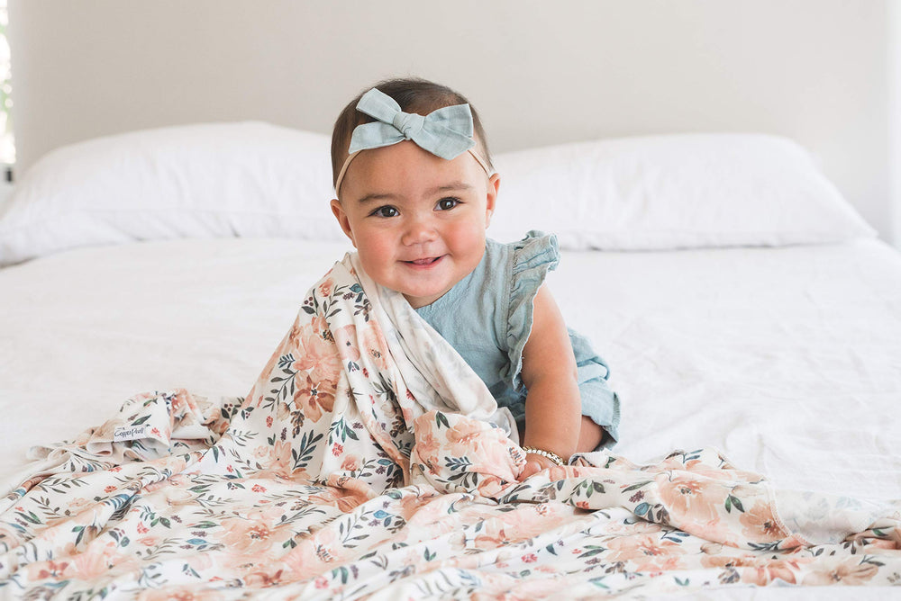Copper Pearl Large Knit Swaddle Autumn pattern adds stylish nursery decor and cozy coverage.