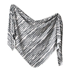 Copper Pearl large premium knit swaddle blanket folded for cozy swaddling and newborn comfort.