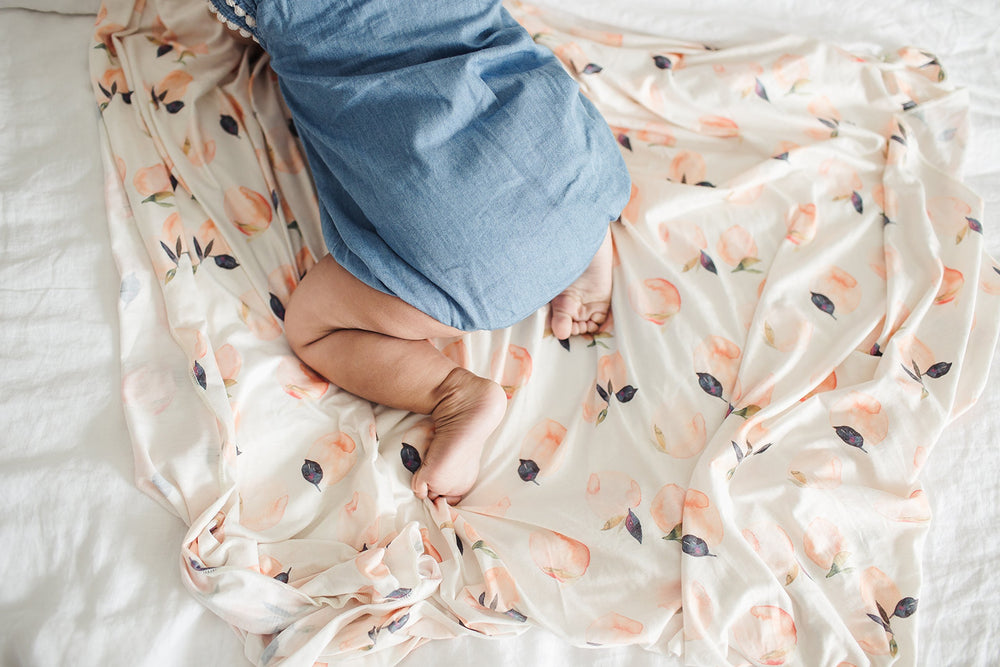 Copper Pearl Large Premium Knit Swaddle Caroline close-up fabric, highlighting softness and premium blend.