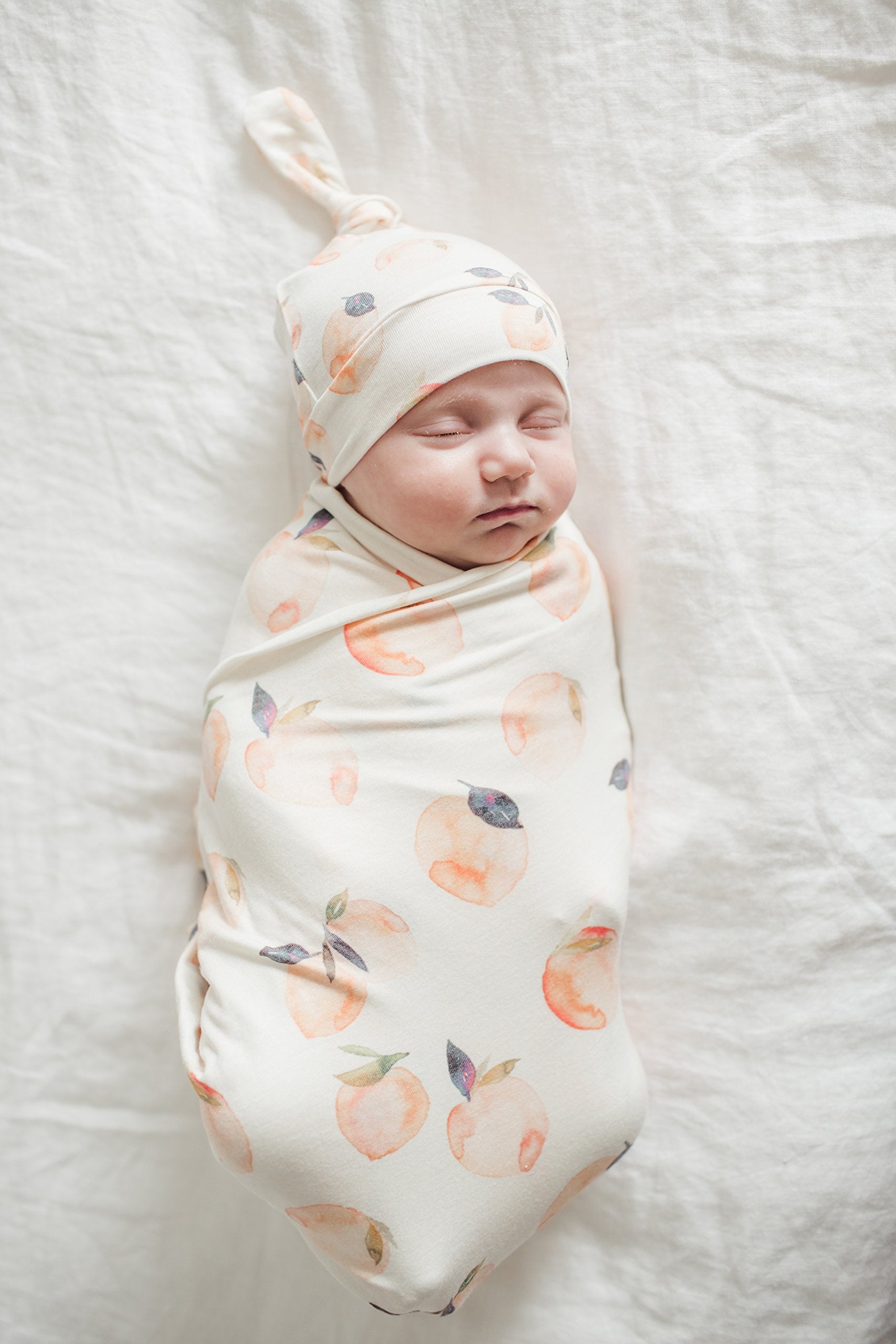 Copper Pearl Large Premium Knit Swaddle Caroline gift-ready packaging, signaling ready-to-gift appeal.